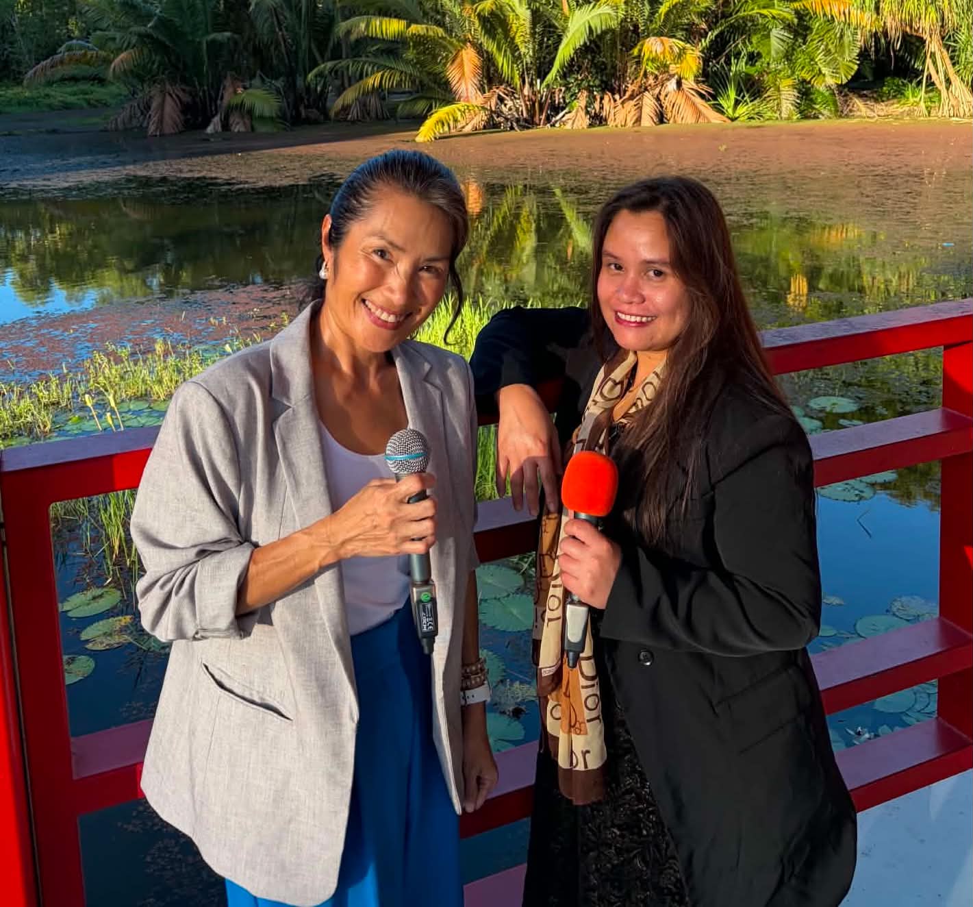 HarmoniYah Duo — MCyen and her duo partner with microphones
