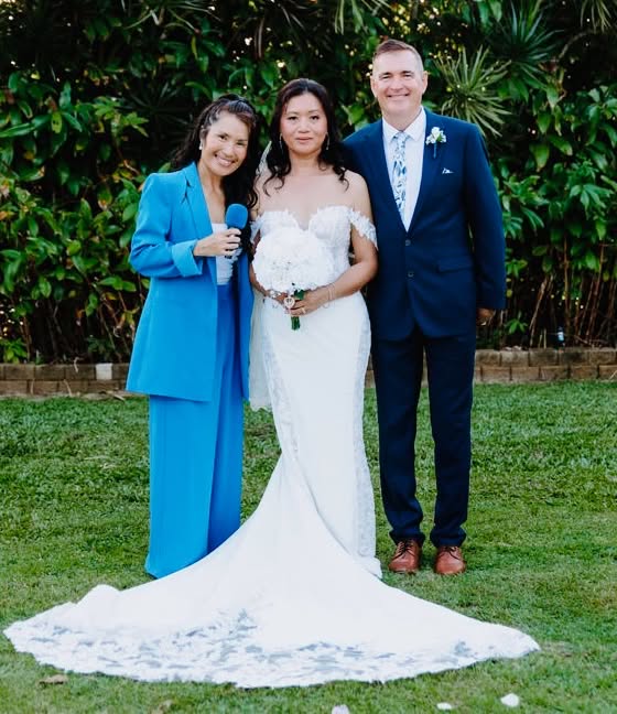 MCyen with a newlywed couple after their wedding ceremony
